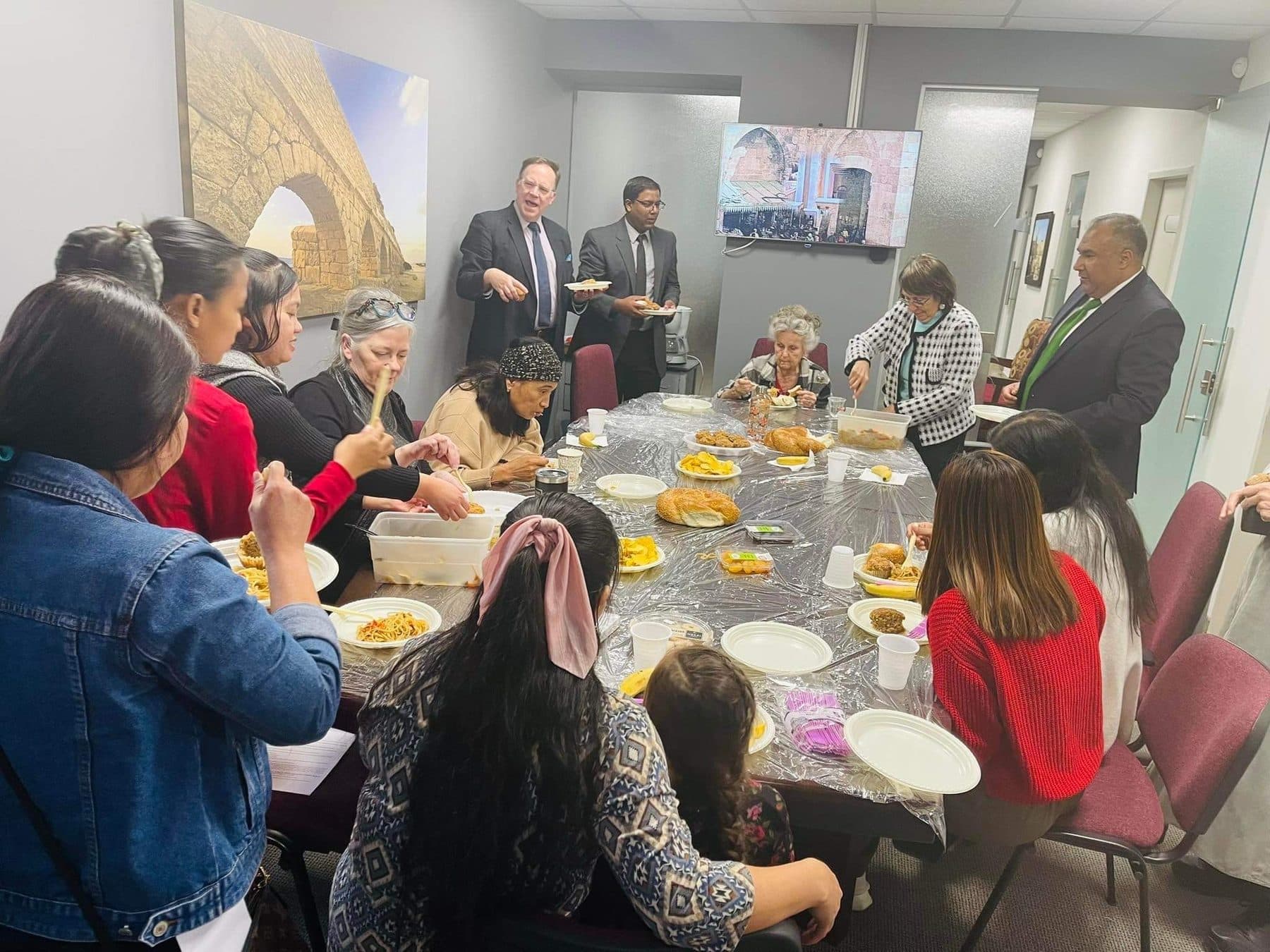 Believers sharing a meal in fellowship