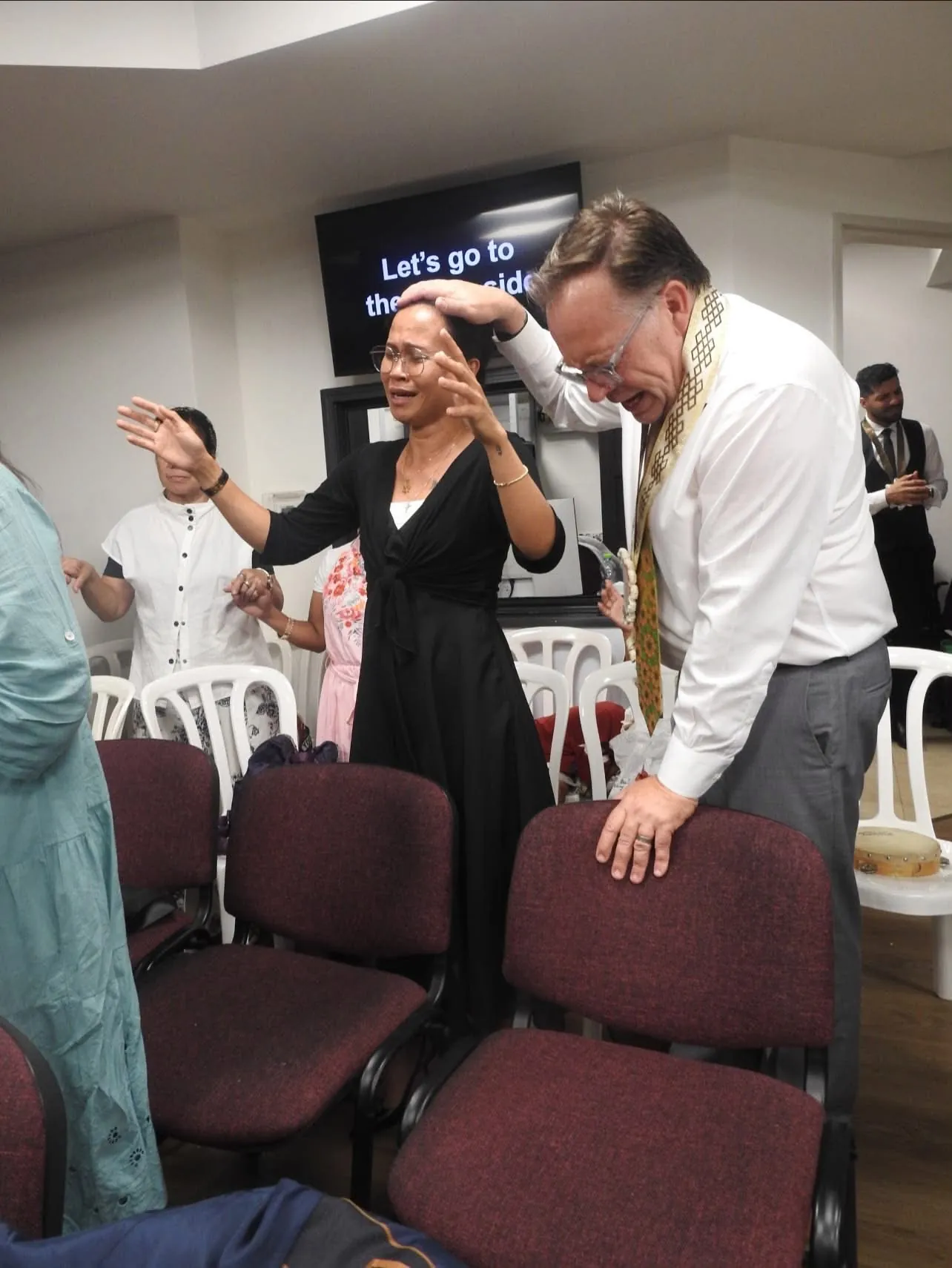 Believers lifting their hands in praise
