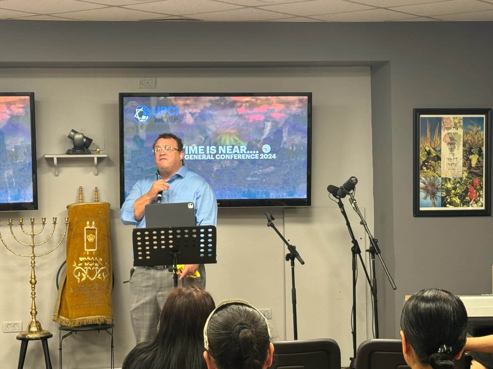 Ministering the Word beside the menorah