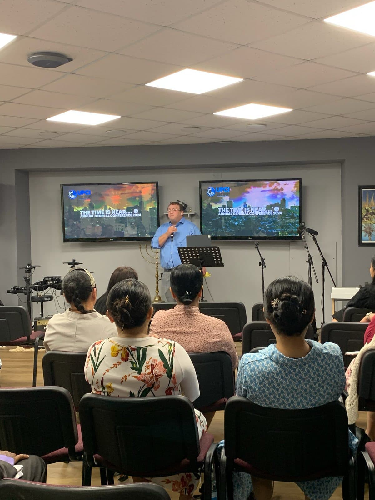 Believers listening during the conference
